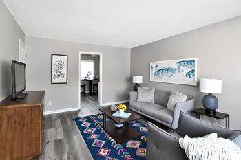 a living room with a couch and a coffee table at Encore 99, East Haven, CT